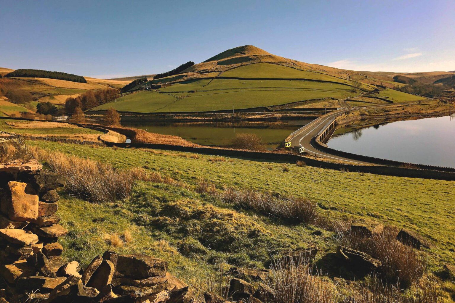 Holmfirth village showcasing rural life with cottages and greenery.
